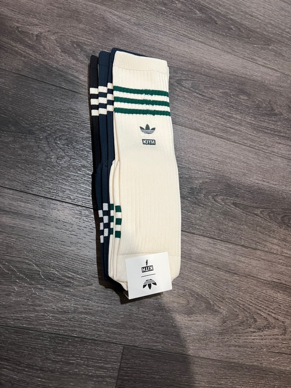 Kith x Adidas Men’s knee high sock. Cream blue and black.